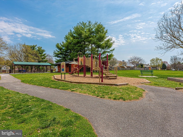 view of playground with a lawn