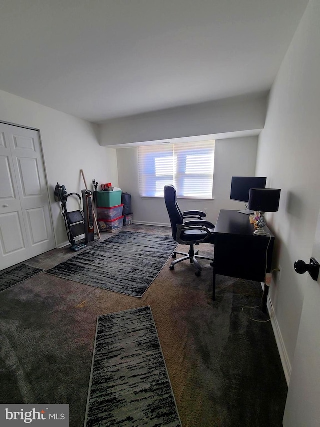 home office with dark colored carpet