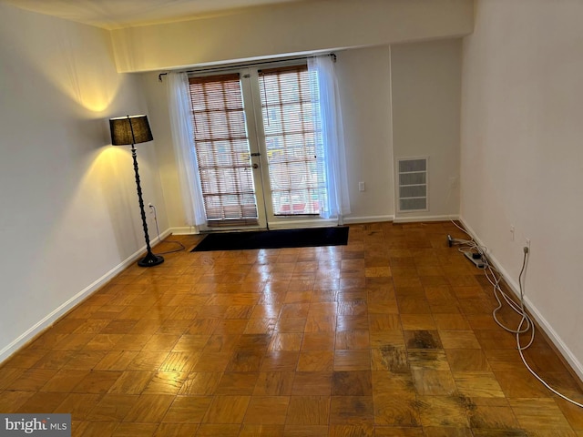 empty room featuring parquet floors