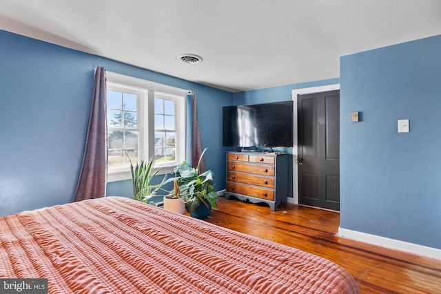 bedroom featuring hardwood / wood-style floors