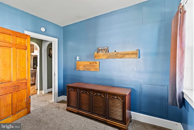 hallway with carpet flooring