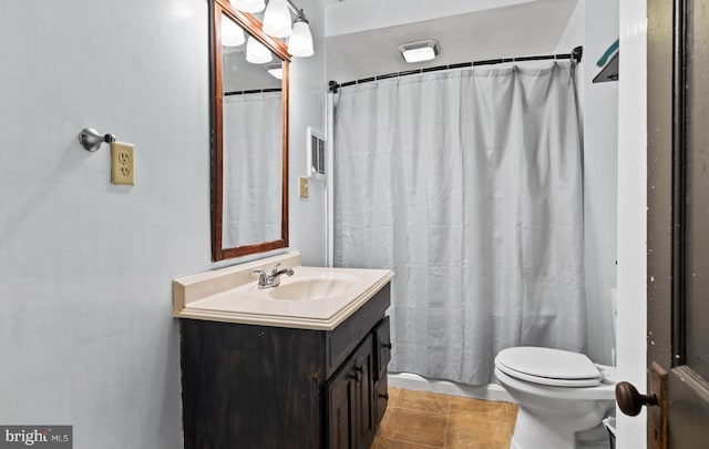 bathroom featuring vanity, a shower with curtain, toilet, and tile patterned floors