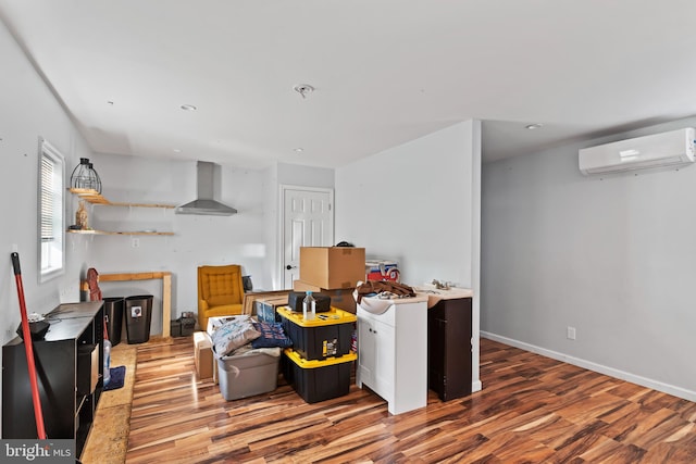 interior space featuring hardwood / wood-style floors and a wall mounted AC