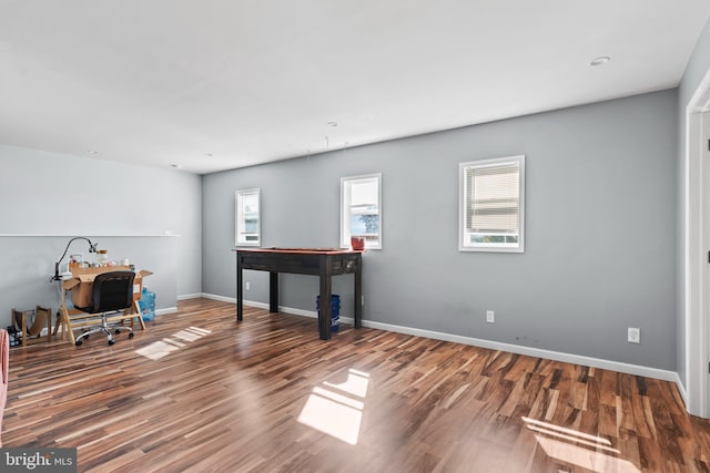 office space with wood-type flooring