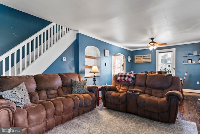 living room with ornamental molding, hardwood / wood-style flooring, and ceiling fan