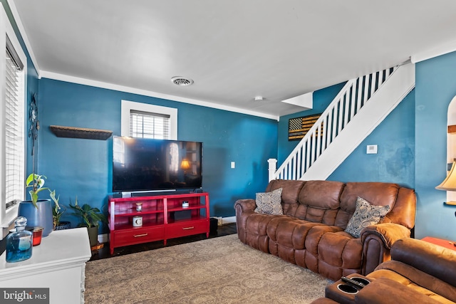 living room with ornamental molding