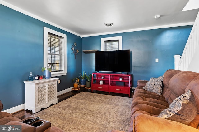 living room featuring ornamental molding and dark hardwood / wood-style floors