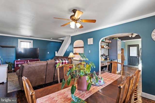 dining room featuring crown molding, dark hardwood / wood-style flooring, and ceiling fan