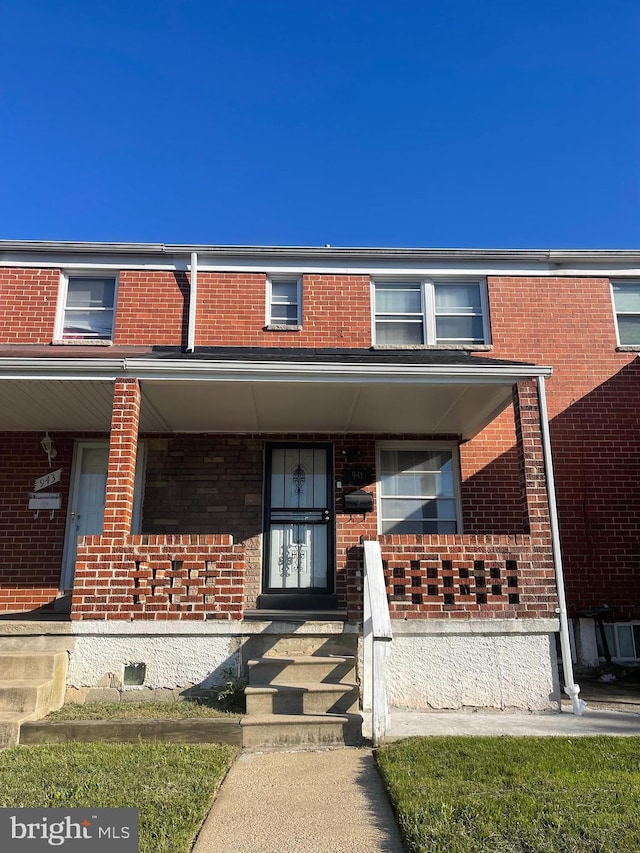 townhome / multi-family property featuring a porch