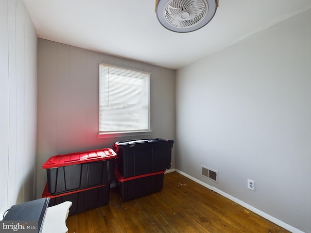 office with dark hardwood / wood-style flooring