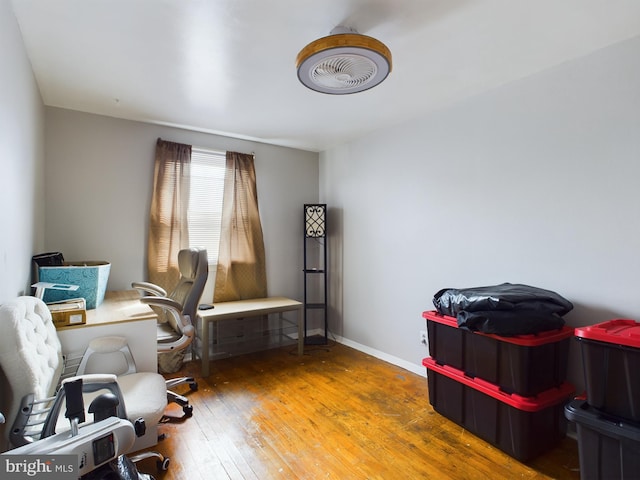 home office with wood-type flooring