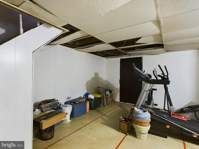 basement featuring a drop ceiling