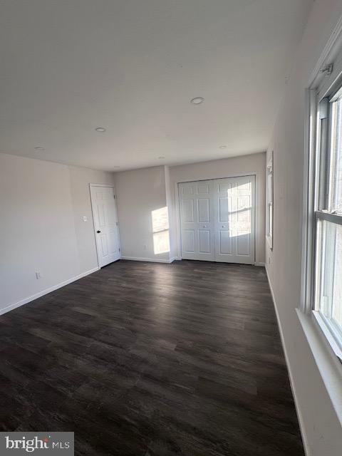 interior space with dark wood-type flooring