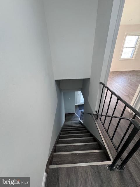 stairs with hardwood / wood-style floors