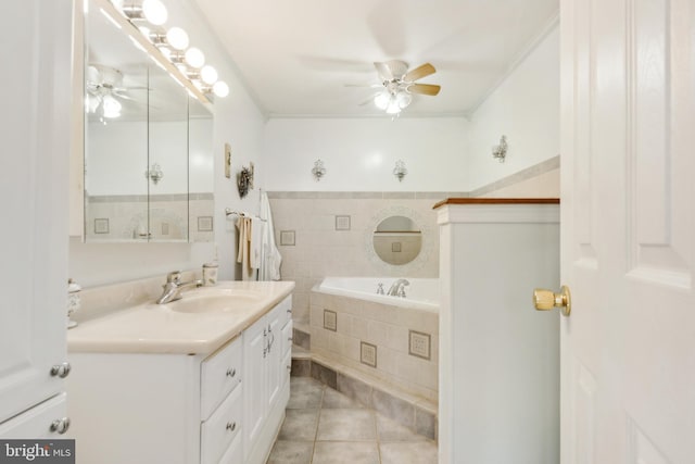 bathroom with vanity, a relaxing tiled tub, tile patterned floors, and ornamental molding