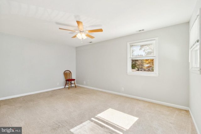 carpeted empty room with ceiling fan