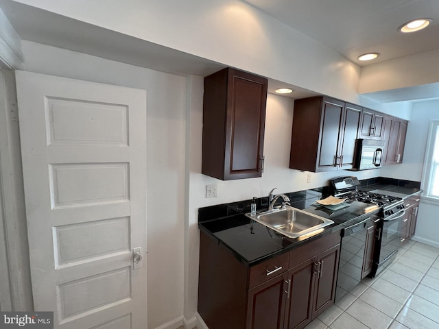 kitchen featuring black appliances, dark brown cabinetry, sink, and light tile patterned floors