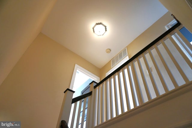 stairway with a high ceiling