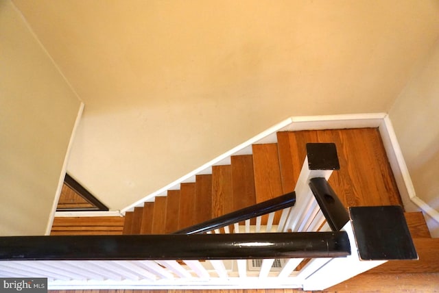 stairs with wood-type flooring