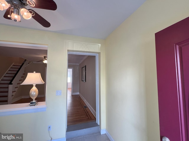 corridor with light hardwood / wood-style floors