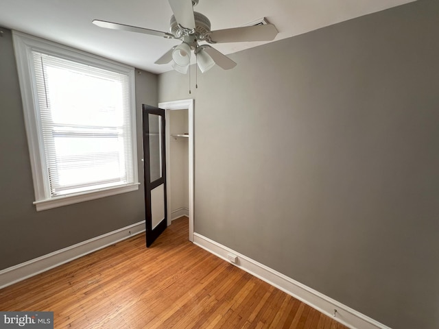 unfurnished bedroom featuring ceiling fan and light hardwood / wood-style flooring