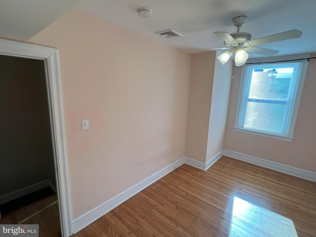 spare room featuring ceiling fan and wood-type flooring