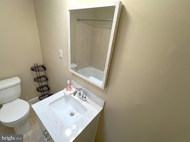 bathroom with toilet, sink, and tile patterned floors