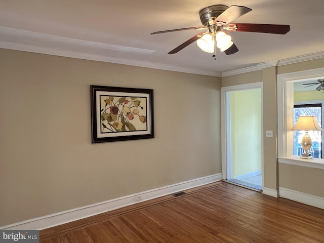 unfurnished room featuring hardwood / wood-style flooring, ceiling fan, and ornamental molding