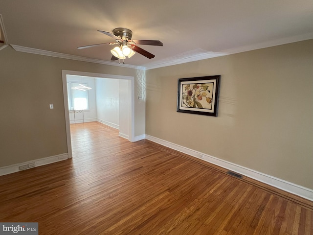 unfurnished room with wood-type flooring, ceiling fan, and crown molding