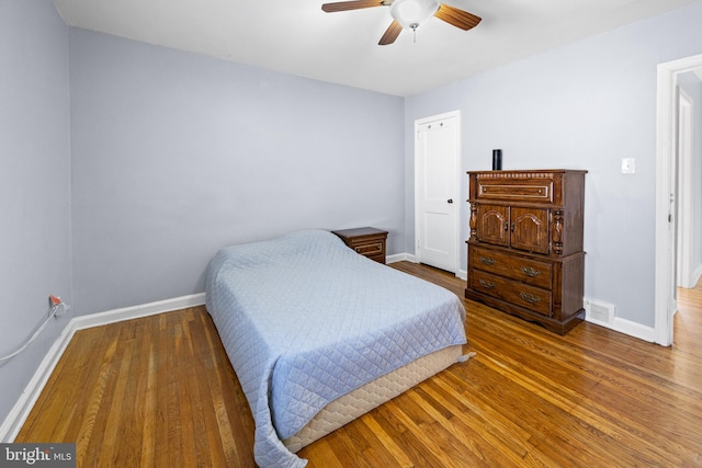 bedroom featuring ceiling fan and hardwood / wood-style floors