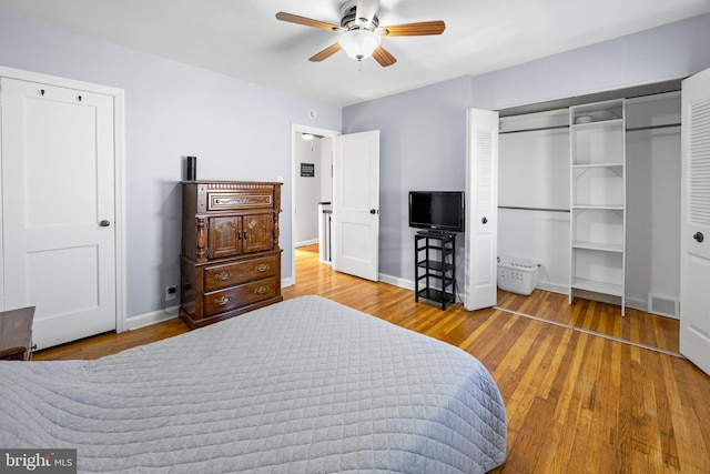 bedroom with ceiling fan and hardwood / wood-style floors