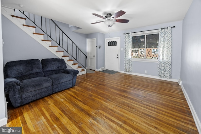 living room with ceiling fan and wood-type flooring