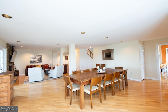 dining area with light hardwood / wood-style floors