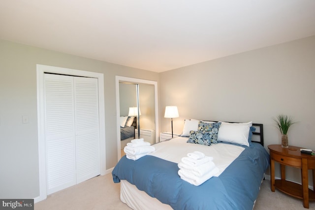 carpeted bedroom featuring a closet