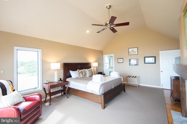 bedroom featuring lofted ceiling, hardwood / wood-style flooring, and ceiling fan