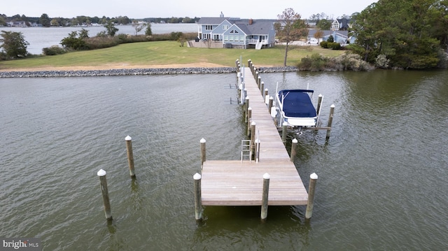 dock area featuring a water view and a yard