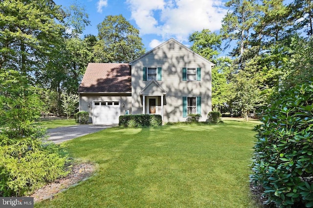 view of front facade with a garage and a front yard