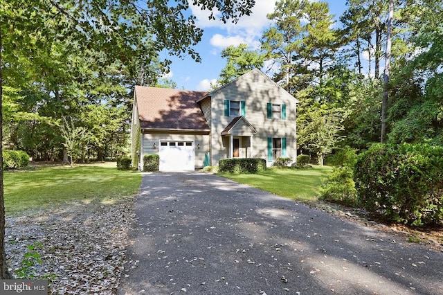 view of front of property with a garage and a front yard