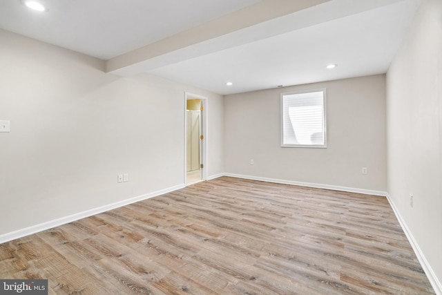 spare room with light hardwood / wood-style floors