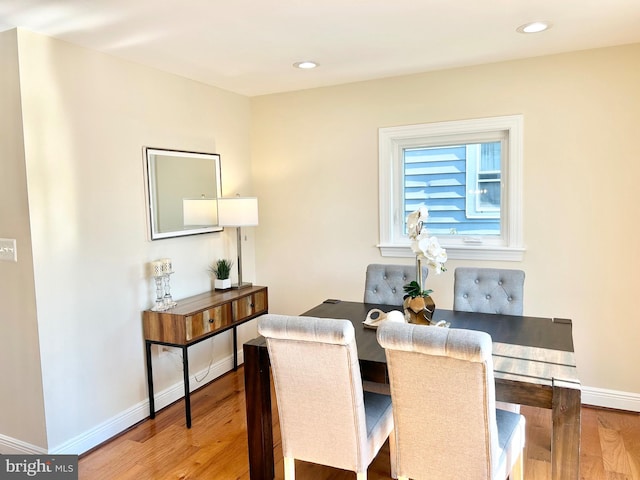 dining area featuring wood-type flooring