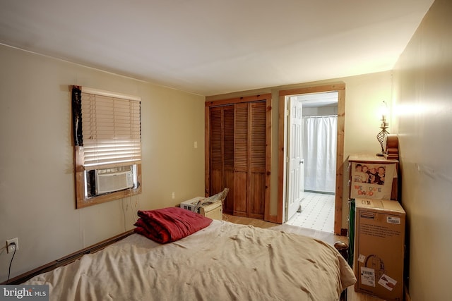 bedroom with cooling unit and a closet