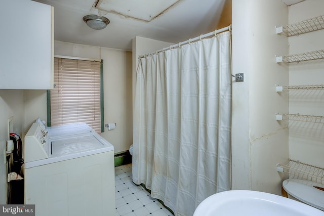 bathroom featuring toilet and a shower with shower curtain