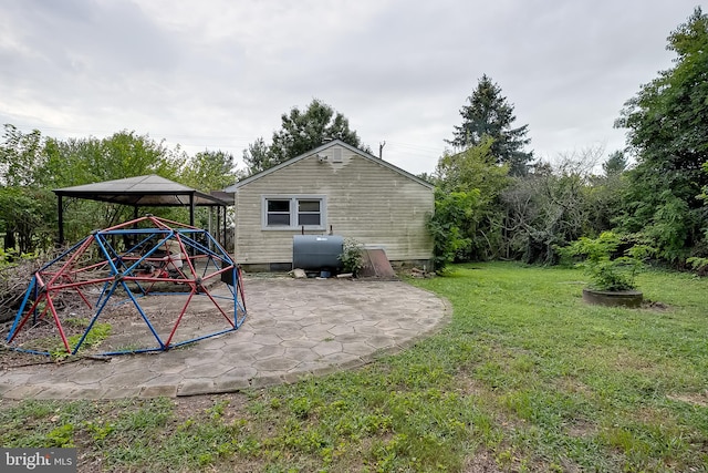 view of yard featuring a gazebo and a patio area