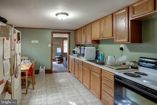 kitchen with white appliances, crown molding, and water heater