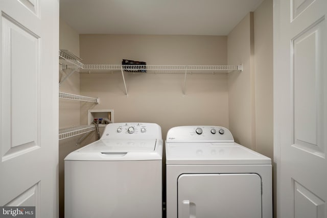 laundry area featuring independent washer and dryer