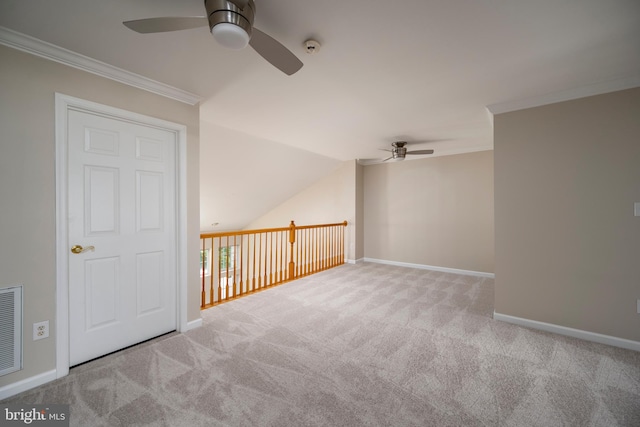 bonus room featuring ceiling fan and light colored carpet