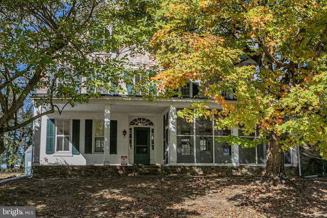 view of front facade featuring a sunroom