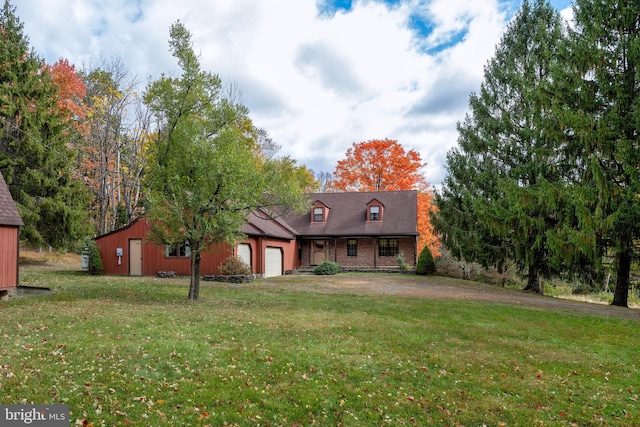 view of front facade featuring a front yard and a garage