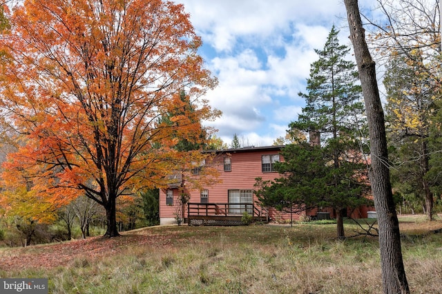 back of property with a deck