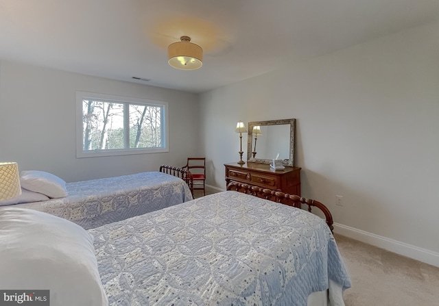 bedroom with light colored carpet